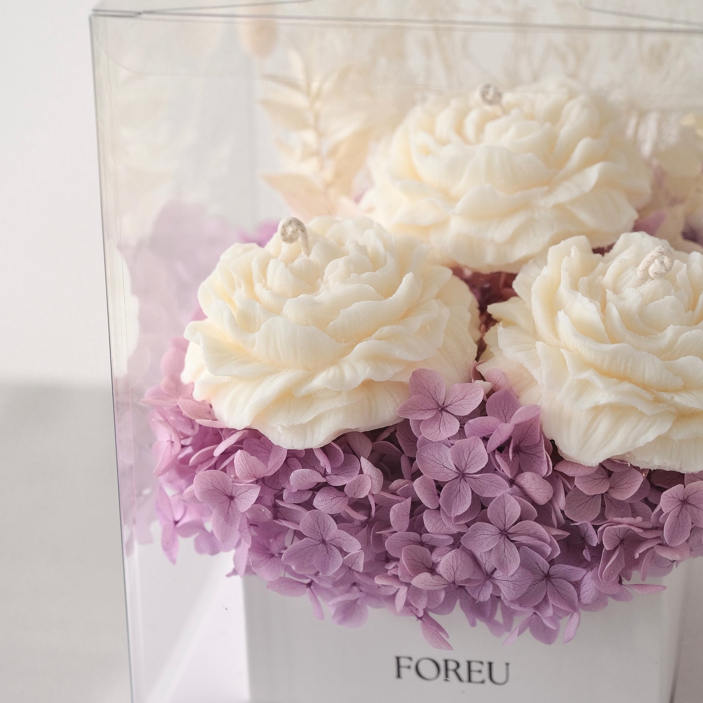 Close up premium flower box, preserved flowers, dried hydrangeas, peony shaped decorative soy wax candles