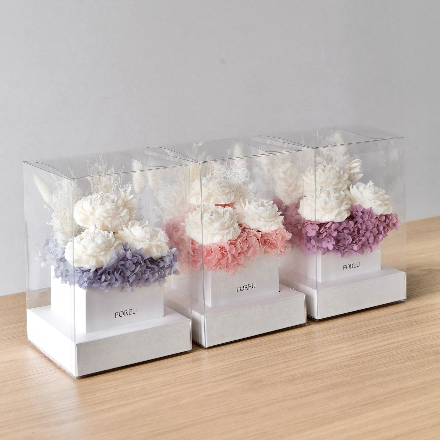 All of Foreu Studio's flower boxes in the three colourways, blue, pink and purple. Premium flower boxes for any occasion.
