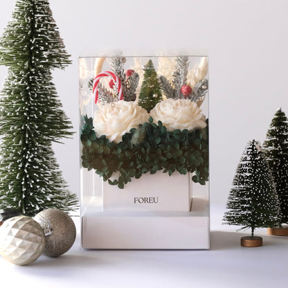 FOREU Studio Limited Edition Christmas Candle Box with soy peony candles, dark green hydrangeas, and festive holiday decorations in a clear premium gift box luxury handcrafted Christmas gift idea. christmas gifting timeless premium box for present with ornaments and christmas display includes soy peony flowers and dark green preserved hydrangeas 